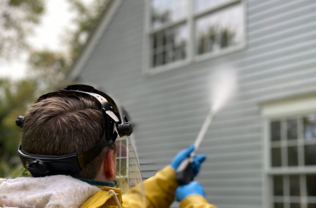 A Professional Jetting employee performing hydro jetting services in Robertson County, TN, ensuring clear and functional pipes.